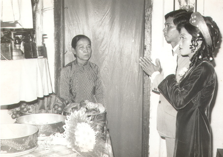 Nhat Nguyen, Thu Le, and Hoi Le(Thu's Aunt) on their wedding day in Sai Gon, V.N. It's a ritual on the wedding day for newly weds to pray to their ancestors for their blessings before becoming husband and wife.