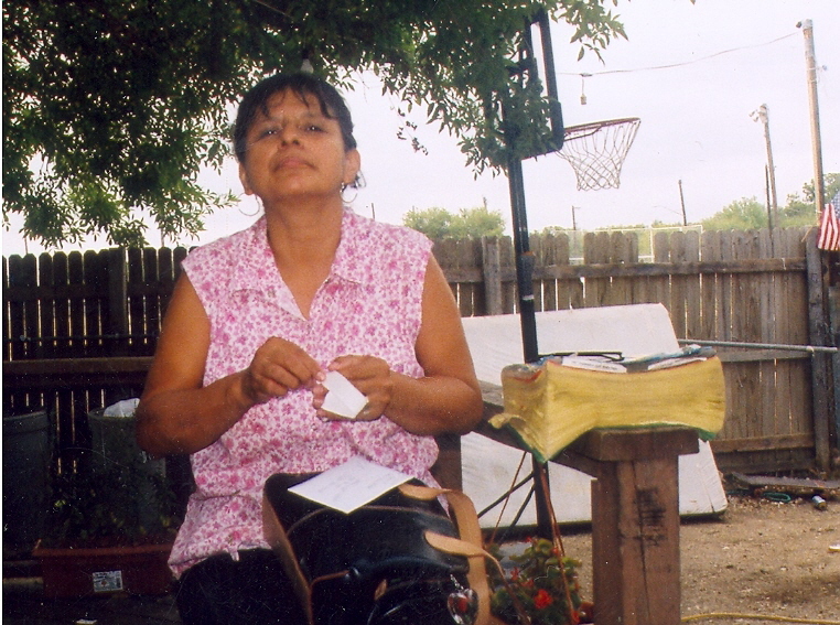 Dora, looking for a job, at her house, 2004