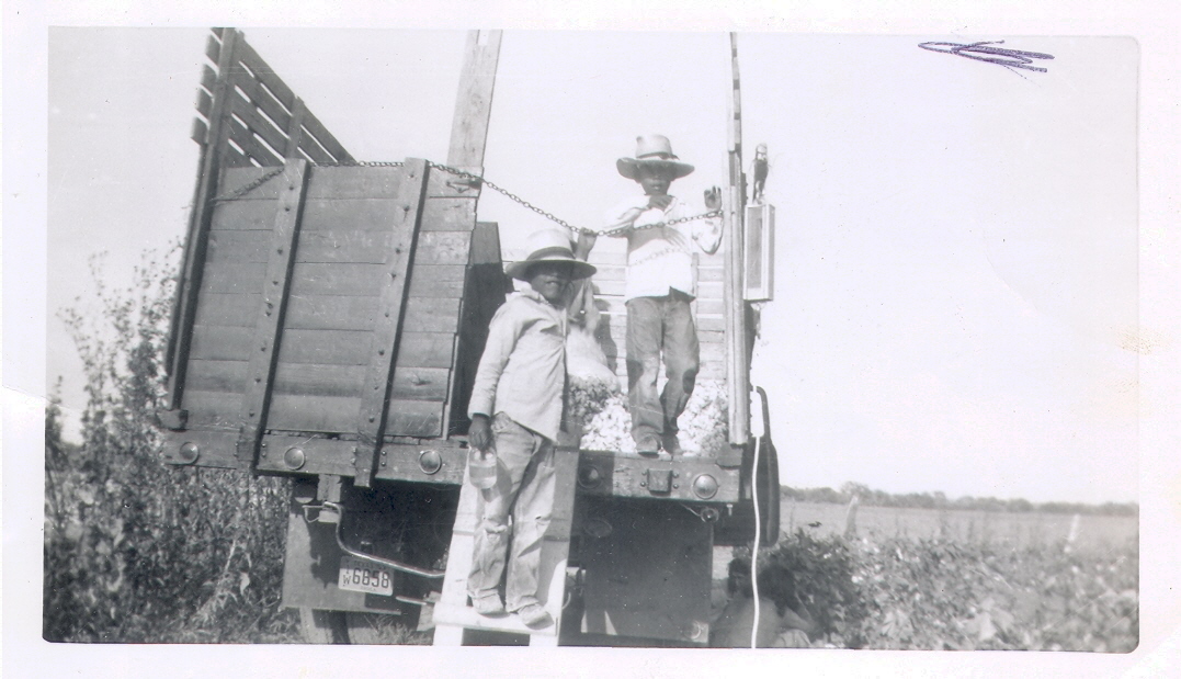 Uncles loading truck in 1953