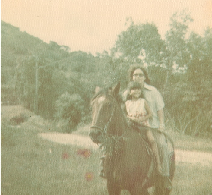 Theresa with student giving horse back riding lessons, Kaneohe, Hawaii, 1974