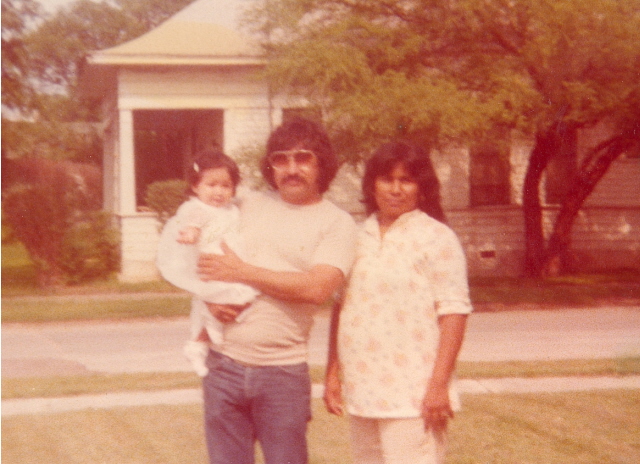 gloria and pablo with goddaughter in the 70's in front of house.