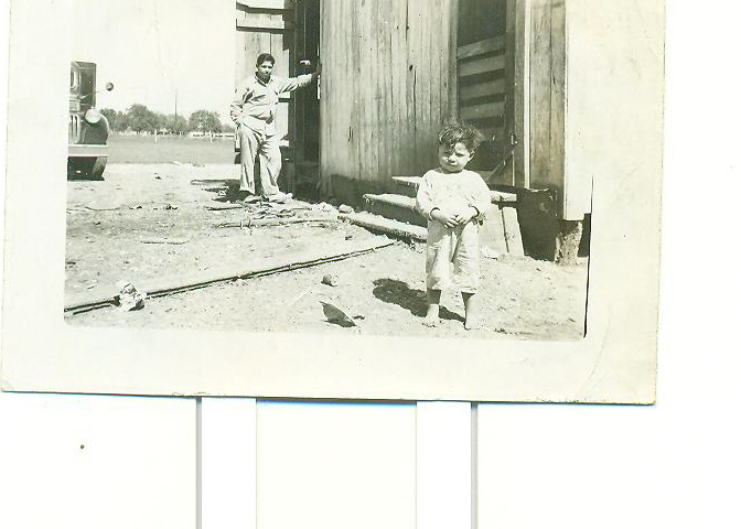 Alfonso and Frank Jr., What, at their farm house, around 1944 and 1945