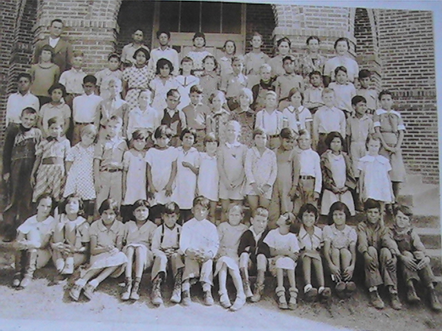 First Class Picture in front of Red Brick School