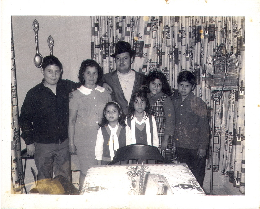 From the left, Ben Jr.(13), Margaret (42)pregnat with Javier,Ben Sr. (40),Laura(11), Gilbert (12), bottom Letty my mom(7), and Olga(9)