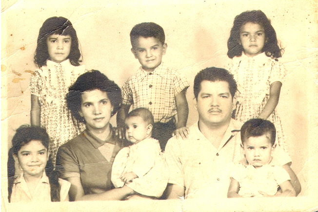 Maria Gonzalez, her husband Perfecto De la Torre and kids. On the top line from left to right Olga, Perfecto jr., Maria and at the bottom line from left to right: Eva, Margarita and Humberto. At Monterrey, Nuevo Leon, Mexico(1960)