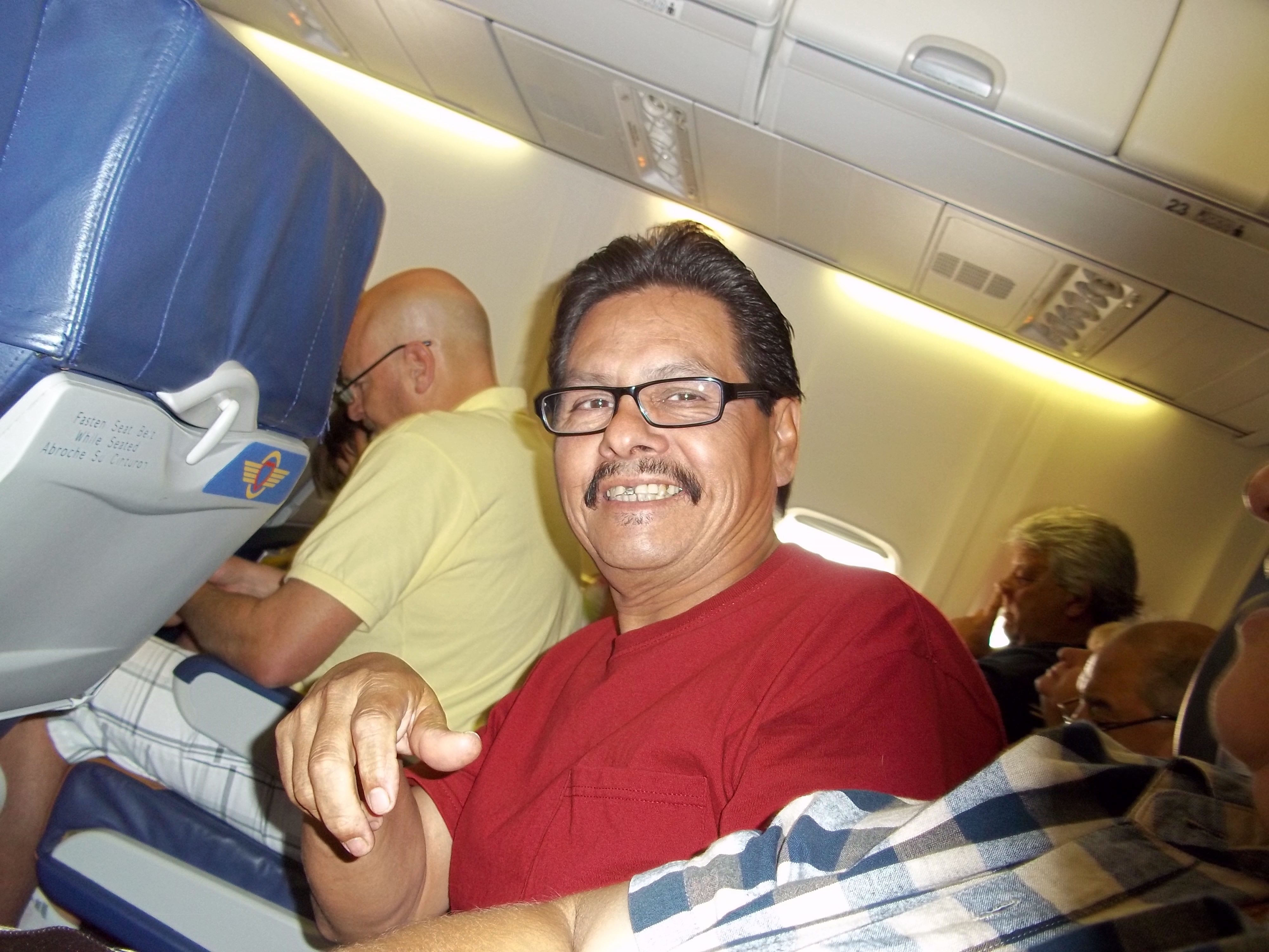 My dad, Jose, on board a flight to Las Vegas, July 2011