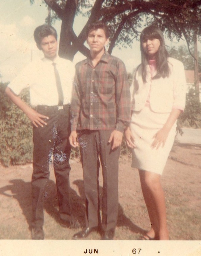 Photographed in front of West Side aprtment on Ocaso Rd. Brother Raul, Jimmy, and Rebecca
