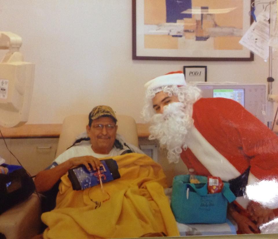 Reynaldo Jimenez with Santa (2013)