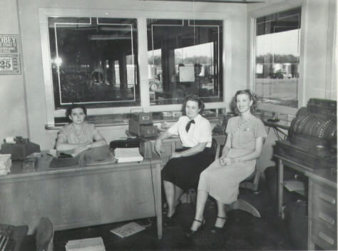 Helen (sitting behind desk), Agnes, and Freida in the office at Sweeney & Company Grocery Wholesale.