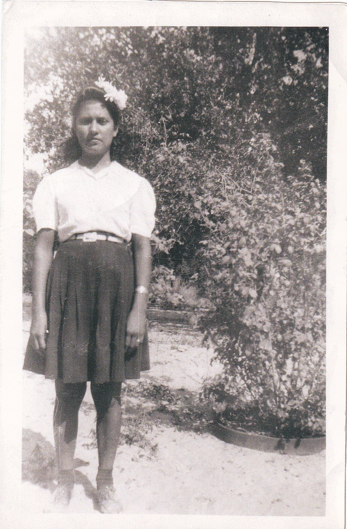 Consuleo at her Tia Inez's back yard in Rosville TX 1947