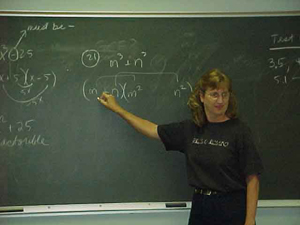 Math Department Chair Julie Kern works through a math problem for her students. Photo by Michelle Tyler