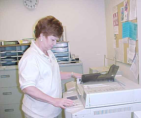 Linda Myers, senior secretary, makes copies at the Ozuna Learning Resources Center.  Photo by Michelle Tyler