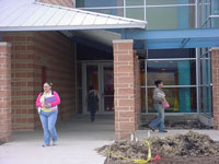 Photo of students walking into new building