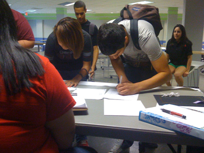SAC students sign petitions to fight the tuition increase.