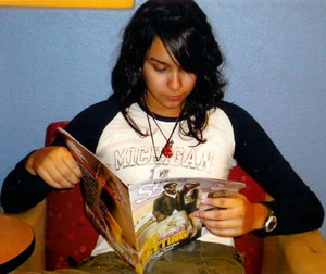 Amariah reads Study Break magazine during her down time between classes.